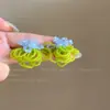 Pendientes de borla de flor de cuentas de color dopamina para primavera, sensación de lujo ligero y alta gama, pendientes atmosféricos estilo vacacional para mujer