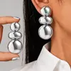 Pendientes metálicos brillantes exagerados de venta caliente transfronterizos, pendientes colgantes geométricos redondos irregulares, pendientes de alta gama, al por mayor en stock
