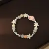 Lindo Pulsera de Cerámica Estilo Dopamina con Encantos de Estrella de Mar y Caracola Temática Oceánica, Joyería de Mano Dulce y Femenina al por Mayor