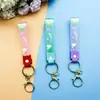 Llavero de accesorios de muñeca linda de cuerda de cuero de caucho suave pvc de arcoíris de deseo creativo accesorios de llavero para bolsa de pareja