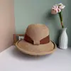 Sombrero de paja de ala ancha tejido de paja fina con ala enrollada estilo francés, sombrero de pescador de temperamento moderno, sombrero con protección solar para vacaciones en la playa