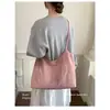 Bolsa de lona casual de gran capacidad para mujer, nuevo modelo 2026, bolso de hombro con cierre de cordón, bolso de mano tote moderno y versátil