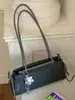 Bolso de mano a la moda y moderno estilo coreano, nuevo modelo verano 2026, bolso baguette simple y elegante, bolso de hombro casual relajado