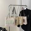 Bolso de paja de gran capacidad de moda 2023, nuevo bolso de cubo de estilo occidental simple, bolso de hombro de estilo occidental personalizado, bolso de mano