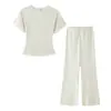 Ropa de mujer transfronteriza 2026 nueva moda europea y americana ajustada con huecos manga corta cuello redondo conjunto de camisa + pantalones largos para mujer M6060