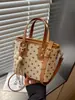Bolsa feminina de alta qualidade transfronteiriça 2026 nova moda tendência primavera-verão requintada super popular bolsa de ombro transversal tipo balde