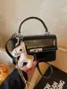 Bolso de Mano Mini Exquisito de Textura de Alta Gama para Mujer 2026 Nueva Moda Versátil Bolso Cruzado Bolso Cuadrado Pequeño Retro de Cuero Aceitoso
