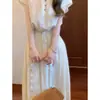 Nuevo conjunto de moda nacional estilo chino para personas petite, conjunto de dos piezas súper elegante de camisa blanca y falda, color liso, Otoño 2026