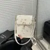 2025 Nueva Moda Encaje Tejido Todo Fósforo Bolso de Hombro Cruzado para Mujer Diseño de Nicho de Gama Alta Bolso Cubo Portátil