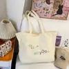 Bolsa de Lona Estilo Ins Preguiçoso Coreano para Mulheres 2026 Nova Versátil Bolsa de Ombro Grande Capacidade Casual para o Dia a Dia