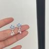 Pendientes de margaritas azules con borlas frescas y elegantes, con diseño de nicho, elegantes y ligeros, de lujo para mujer.