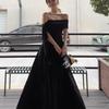 Vestido negro de estilo Hepburn francés al por mayor con hombros descubiertos, lazo y falda grande, temperamento de hermana real de verano para mujer, falda larga