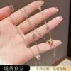 Diseño de Nicho de Lujo Ligero con un Toque de Alta Gama, Collar de Flor de Cuatro Hojas con Borlas de Cintura Delgada, Cadena para Clavícula Versátil Dulce y Elegante