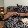 Juego de ropa de cama de cuatro piezas de algodón puro estilo Muji sábana de algodón funda de edredón rayas blancas y negras sensación de lujo ligero alta gama ropa de cama juego de tres piezas para dormitorio