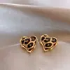 Aretes de corazón con estampado de leopardo, aguja de plata, marco dorado, aretes estilo chica hot dulces y geniales, venta al por mayor de aretes de lujo ligero de alta gama para mujer