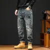 Marca de Moda Urbana Americana Jeans Parche Rasgados Holgados Otoño e Invierno Hombres Pantalones Harem Retro Desgastados Cónicos Modernos