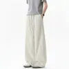 Calça casual da moda em retalhos de cor sólida para homens, calça básica de perna curva estilo americano para outono, calça de cintura com cordão, drapeada, de comprimento total, high-street
