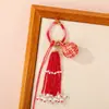 Nuevo Bolso Colgante de Bola de la Suerte Tejido a Mano Bolso Colgante Encanto Tendencia Nacional Nicho Borla Llavero de Pareja Colgante Venta al por Mayor