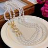 Collar de perlas redondas de lujo estilo francés con incrustaciones de diamantes, elegante diseño de nicho, cadena de clavícula con sentido de moda, joyería de alta gama para mujeres.