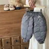 Pantalones de plumón de pato blanco para bebé Otoño e Invierno 2026 Nuevo Estilo Coreano para Bebés Gruesos Cálidos Elegantes Pantalones de plumón Clase A