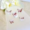Nueva decoración luminosa de uñas con degradado fino y suave de mariposa mixta, resina tridimensional con degradado cibernético rojo.