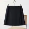 Falda de traje gris para mujer para primavera y otoño 2026, nueva moda de cintura alta adelgazante, falda de línea A con abertura y diseño ajustado