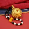 O dragão e a fênix em relevo giram a chaleira ao redor da mini chaleira imediatamente giram a peça da alça manual chinesa para brincar de artesanato de mahjong