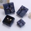 En stock Cartón azul para joyería caja de joyería con lazo tapa pulsera collar colgante aretes caja de regalo para joyería