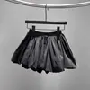 Saia-short bufante estilo coreano com estampa de flor de nuvem botão para mulheres verão 2025 nova cintura alta emagrecedora plissada irregular meia-saia