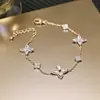 Pulsera Flor de Circonita Chapada en Oro Real Nicho Dulce Versátil Pulsera Temperamento Lujo Ligero Joyería de Gama Alta para Mujeres Al Por Mayor
