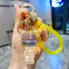 Llavero de Oso de Resina Transparente Blanco con Hojuelas Doradas Dibujo Animado Muñeca de Resina con Polvo Dorado Colgante Lindo para Bolso Pequeño Regalo