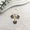 Llavero de mariposa nuevo transfronterizo aleación de zinc europea color llavero de mariposa monarca pequeño exquisito colgante para bolsa