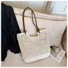 Bolso de mano grande de paja para mujer, nuevo bolso tejido para la playa de vacaciones en la costa primavera 2026, bolso de un solo hombro para debajo del brazo para mujer