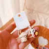 HD2112A025 Palomitas de Maíz Color Crema Lindo Panda Pequeño Moda Nicho Creativo Niñas Elástico Anillo para el Cabello de Niños Mujeres