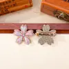 Brocado Song de cinco pétalos de flor de cerezo acabado en el pecho puntada colorida tela de brocado Song broche de flor de cerezo de aleación accesorios de ropa de estilo antiguo lote mixto