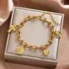 Pulsera Pulsera de Acero Inoxidable en Forma de U con Colgante Múltiple Corazón Cabeza Cruzada Nueva Belleza Cruzada Europea y Americana