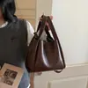 Bolsa Tote Retrô Transfronteiriça para Mulheres 2026 Nova Coleção de Primavera Casual Grande Capacidade Bolsa de Ombro de Mão Bolsa Transversal para o Dia a Dia