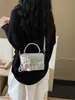 Bolso pequeño rosa a cuadros súper popular para mujer, nuevo bolso cruzado versátil de moda 2026, bolso cuadrado pequeño informal tipo caja estilo coreano