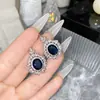 Versa set alto joyería imitación corindón azul traje de alta calidad chapado en oro microincrustado circonita moda noble gas pétalo pendientes