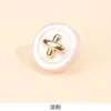Casaco feminino fashion com botões redondos de metal, camisa com acessórios de vestuário e componentes decorativos estilo novo chinês estilo Chanel