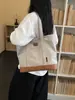 Bolsa de lona gruesa, simple, de gran capacidad 2026 nueva moda, bolso de mano y bolso de hombro versátil para ir al trabajo para niñas