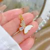 Cobre Oro Real Concha Blanca Mariposa Dorada Soñadora Moda Transfronteriza DIY Joyería Cobre Circonita Microincrustación Colgante
