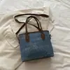 Bolsa transversal feminina, alto valor estético, pingente de estrela fofo, design único, bolsa de mão jeans vintage de nicho