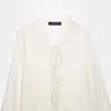 Atacado transfronteiriço 2026 Moda europeia e americana camisa feminina com babados de renda emendada, decote V, manga longa, manga sino D6965