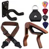 Amazon trajes de accesorios para guitarra transfronterizos, juegos de fundas para dedos de cuerdas, púas de guitarra, almohadilla para uñas de cuerdas, cambiador de cuerdas tres en uno