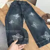 Jeans Bordado Infantil Outono/Inverno 2026 Calças Retas Largas Primavera/Outono Calças Jeans Longas Wide Leg Borboleta para Crianças de Tamanho Médio e Grande