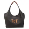 Bolsa de lona de color sólido de alta gama para mujer, nueva de verano 2026, gran capacidad, para ir al trabajo, simple, con letras, bolso de hombro