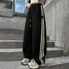 Pantalones Deportivos Casuales con Raya Lateral para Niñas Primavera y Otoño 2025 Nuevos Pantalones Rectos de Pierna Ancha de Moda para Niños Mayores