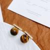 Pendientes elegantes de otoño e invierno con piedra de ojo de tigre de alta calidad, con aguja de plata s925, diseño de nicho simple y moderno, que combinan con todo.