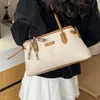 Bolsa de terciopelo simple de gran capacidad 2026 moda diaria para ir al trabajo estilo coreano nuevo bolso de mano tipo tote otoño gamuza elegante bolso de hombro para mujer